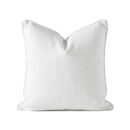 A square white throw pillow with a subtle linen texture and piped edges, centered on a solid white background.
